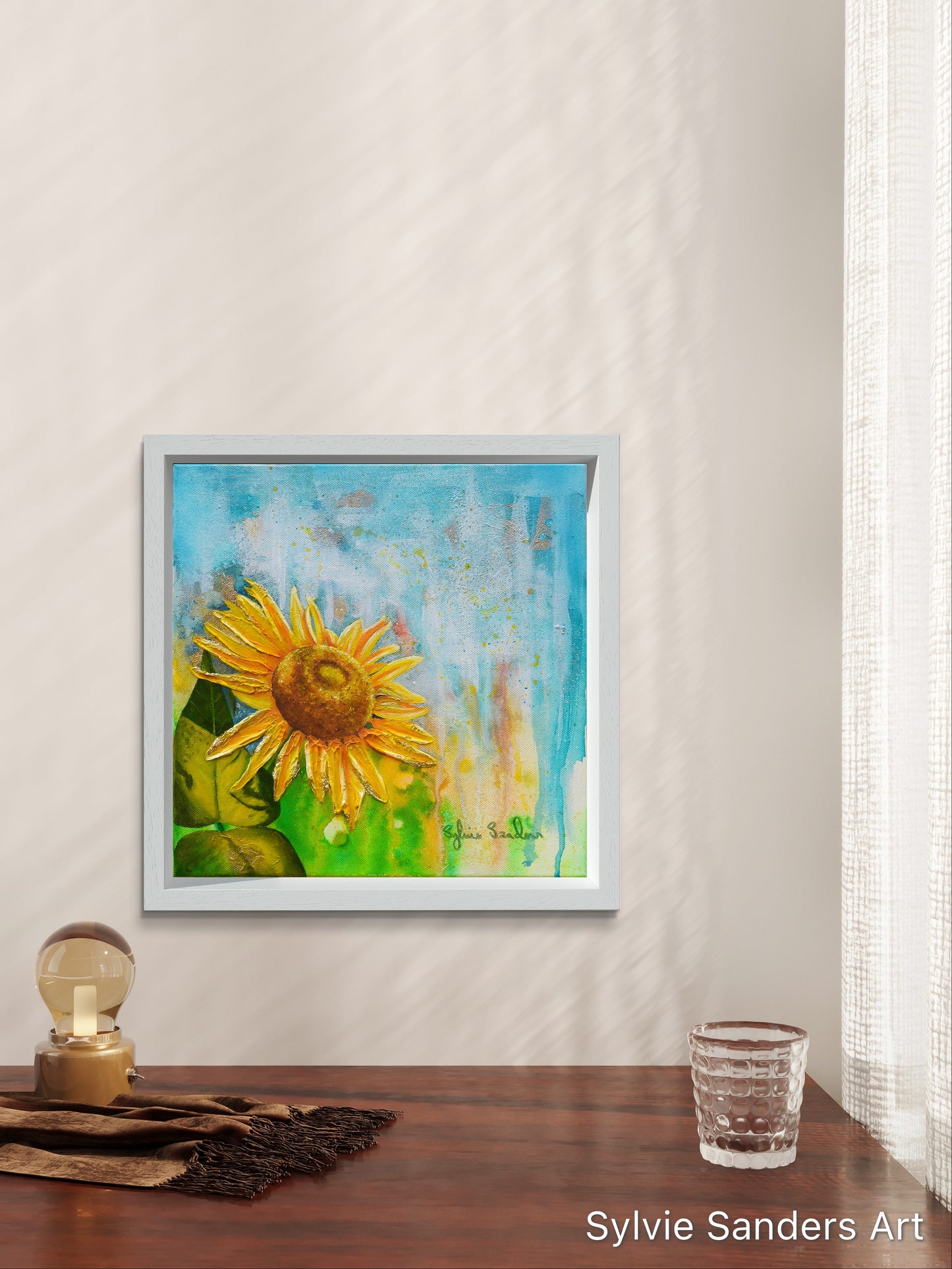 Desk with Sunflower Framed Painting Hanging Nearby